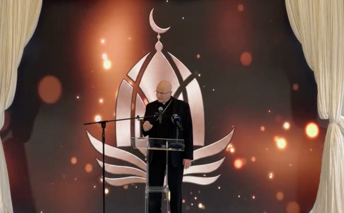 Bishop Weisenburger speaking at a Mosque.