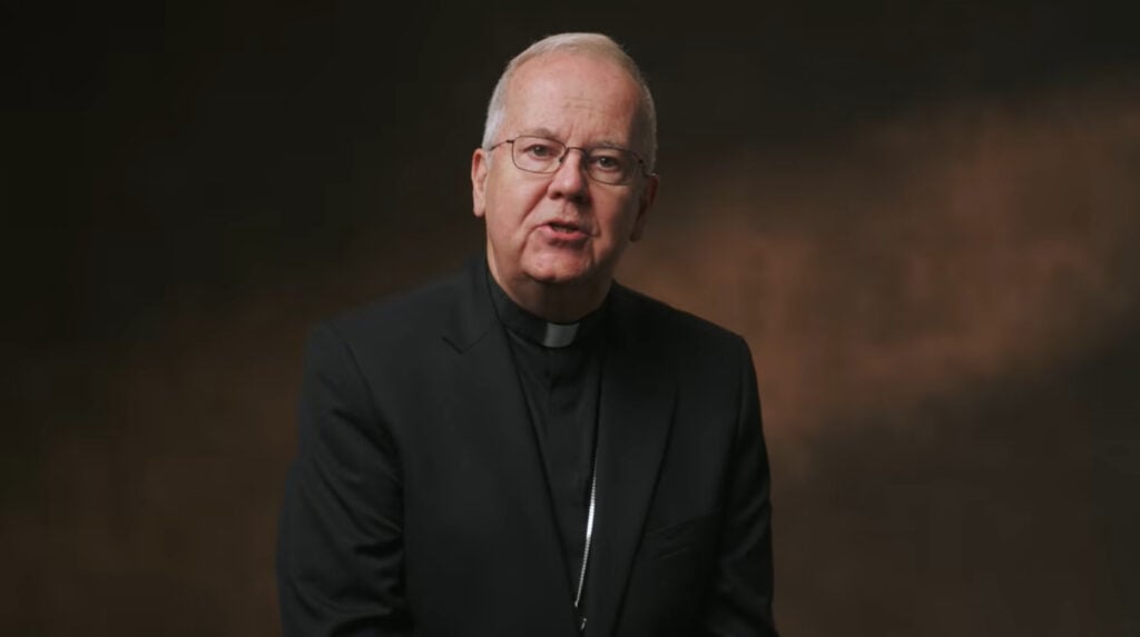 Bishop Joseph Bambera looking at a camera.