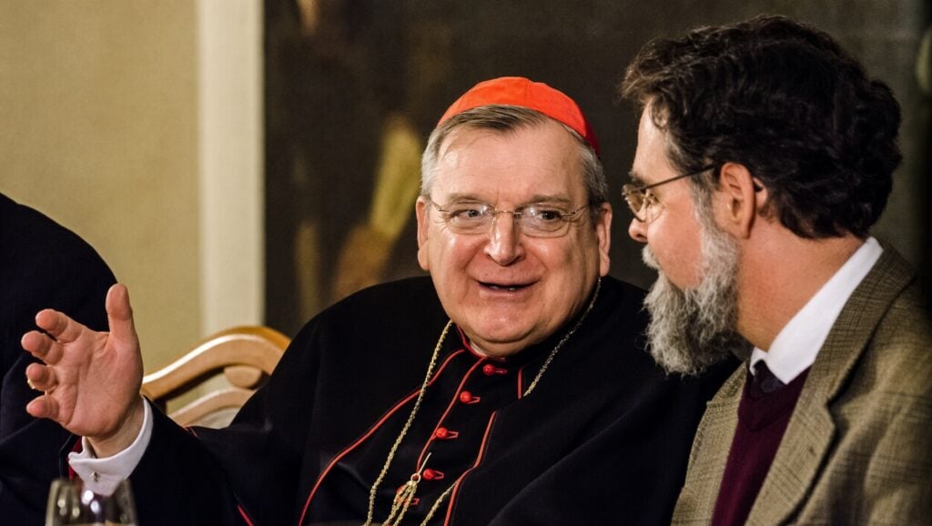Cardinal Burke talking to Dr. Peter Kwasniewski at a book presentation in 2016.